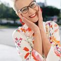 Portrait of a cheerful woman with glasses.